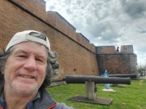 Ted in front of a bunkers with cannons at Fort Pickens, Florida.
