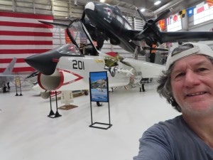 Ted with planes behind him in the Pensacola Naval Museum in Florida.