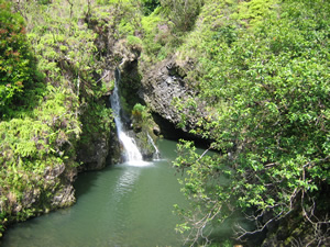 Waterfall into previous pond photo near Hana.