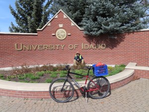 Ted and his bike at the entry sign to University of Idaho campus in Moscow, Idaho.