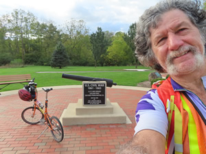 Ted, his bike and Civil War Cannon at the Veterans Memorial park in Richmond, Indiana.