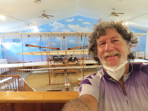 Ted in the museum with a replica of a Wright Brothers plane at the birthplace of Wilbur Wright.