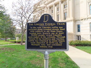 Historic sign about Abraham Lincoln in front of the capital building in downtown Indianapolis, Indiana.