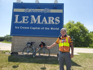 Ted with his bike at the welcome to sign in Le Mars, Iowa.