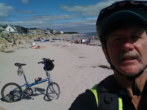 Ted at Goose Rock, Maine beach with his bike 