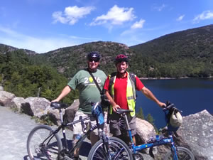 Dave and Ted Stagnone on bikes at Jordan Pond in Arcadia National Park.