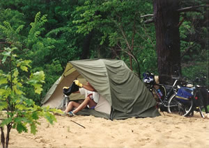 Chuck getting into his tent near Lake Michigan.