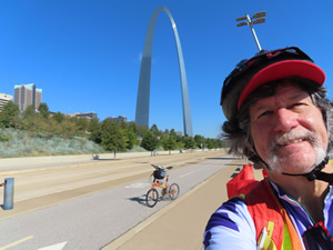 Ted and his bike with the Gateway Arch behind him in St. Louis, Missouri.
