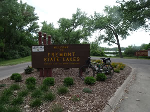 Ted’s bike at park entrance to Fremont State Lakes, Nebraska.