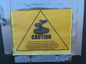 Warning sign on door of restroom at Orovada rest Area.
