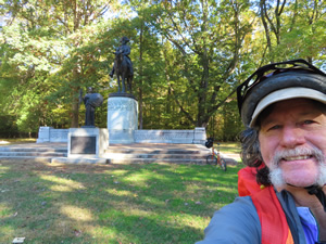 Ted in front of a statue at Guilford Courthouse National Military Park.
