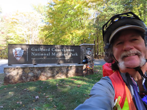 Ted in front of Guilford Courthouse National Military Park entrance sign.