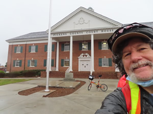 Ted with his bike in front of the Pickens Court house.
