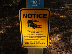 Warning sign on Three River Greenway trail in Columbia, SC.