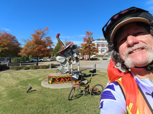 Ted and his bike with a trail side sculpture seen from the Chattanooga river trail.