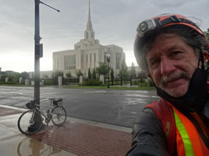 Ted with his bike in from on the temple of Latter-day saints in Ogden, Utah.