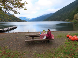 Marty eating lunch at picnic table on Lake Crescent.