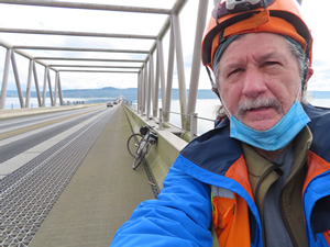 Ted with his bike crossing the hood canal floating bridge near Poulsbo.