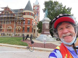 Ted and his bike at courthouse square in Monroe.