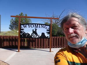 Ted at the sign at Wyoming welcome center.