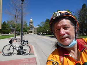 Ted with his bike and Capital building behind him in Cheyenne, Wyoming.