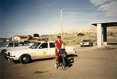 Ted near Police car on Indian Reservation near Second Mesa, Arizona. This photo was taken by an Indian Police officer.