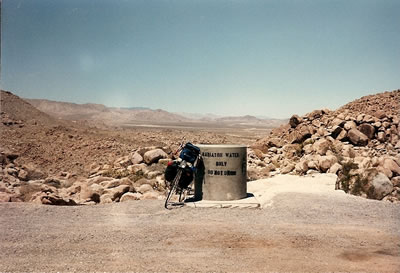 Ted's bike next to a 55-gallon drum of water. These drums are placed every 2/10ths of a mile on the side of the road for car’s radiators on the hill between Ocotillo and Laguna Summit.