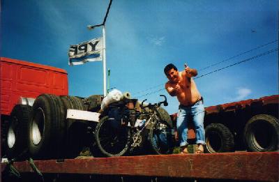 The friend of the trucker and Ted's bike on the truck that took Ted to Esquel.