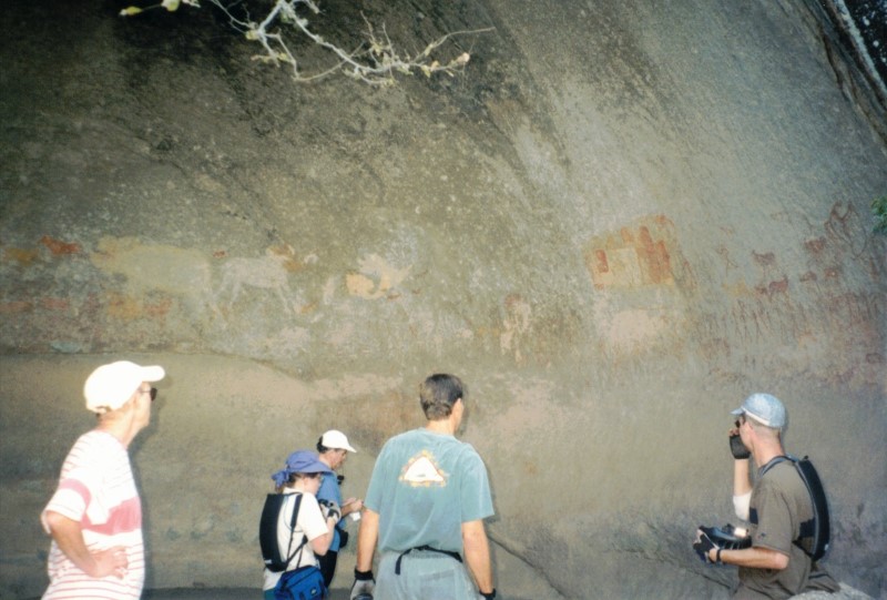 Looking at Petroglyphs in Bambata Cave. - Left to right - Karen, Heather, John, Gary and Ezra