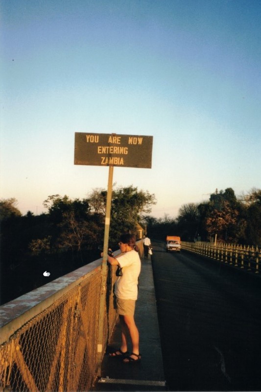 Heather at the border to Zambia on the middle of the bungee jumping bridge at Victoria Falls.