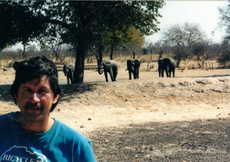 Ted with elephants near a pond close to Hwange National Park.