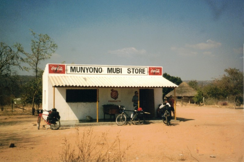 A store that sells warm cokes (no electricity for refrigeration) between Dete and Sianzyundu.  Karen, John and Teda bikes are in front of the store.