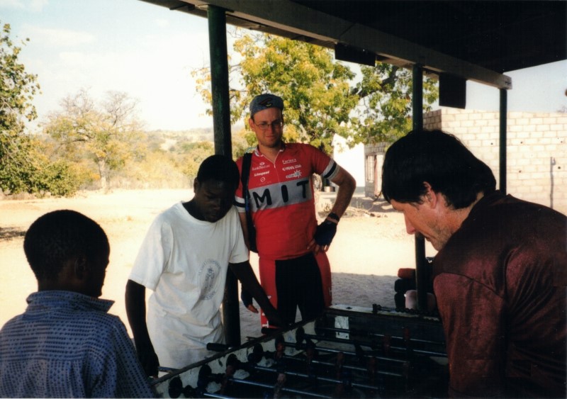 Ted playing foosball (Ted lost 5 to 3) with a native between Dete and Sianzyundu.  Ezra in watching in his MIT bike shirt.