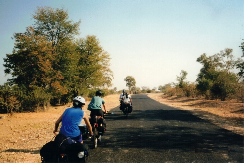 Our group cycling down the road between Sianzyundu and Binga. -.  Front to back - Shingi, Heather, Karen and Becky.