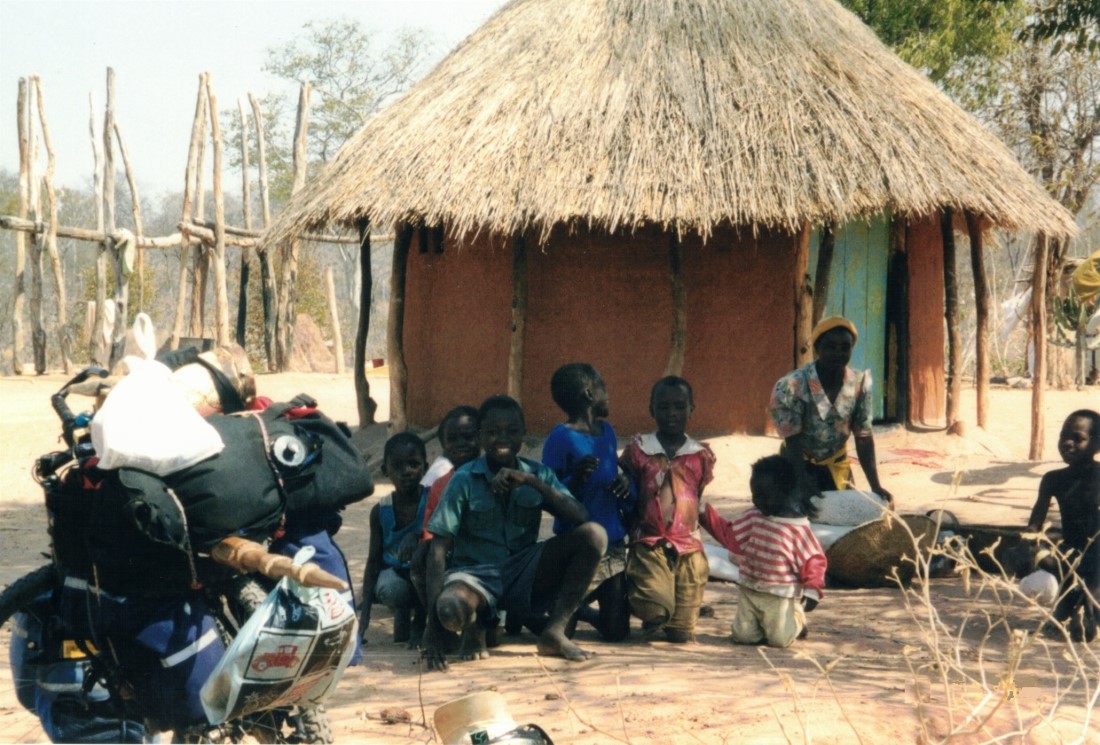 Family Ted gave cloths to between Sianzyundu and Binga.  When I gave the woman some sweat pants she was so happy that she danced around in circles of holding up the sweat pants.