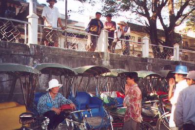 Three wheeled bikers (Traditional Samlors) in Thakhilek, Myanmar (Burma).