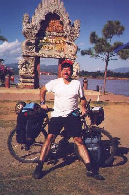 Me with my bike standing in front of the Golden Triangle monument in Sop Ruak, Thailand. 