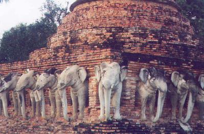 Elephants at the base of a Wat near Sukothai Historic Park. (13th to 15 th century ruins)