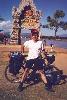 Ted with his bike standing in front of the Golden Triangle monument in Sop Ruak, Thailand.