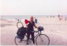 Andrea holding Ted's Bike at beach in Encinitas, California.