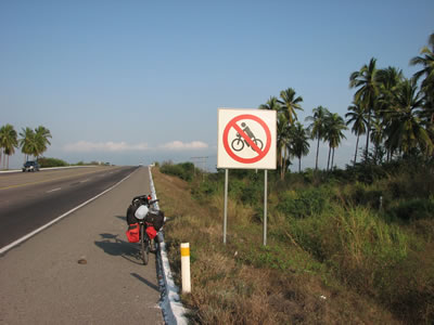 Ted's bike near highway sign on Mexico Highway 200 south of turn off to Manzanillo.