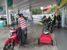 People waiting out Manson at gas station near Johor Bahru, Malaysia