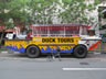 Ted’s bike in front of one the Duck Tour vehicle in Singapore