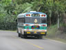 Typical long distance bus in Central America, this one does not have a rack on the roof.  Maybe this is a local bus?