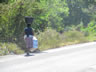 Lady carrying stuff on her head in Honduras