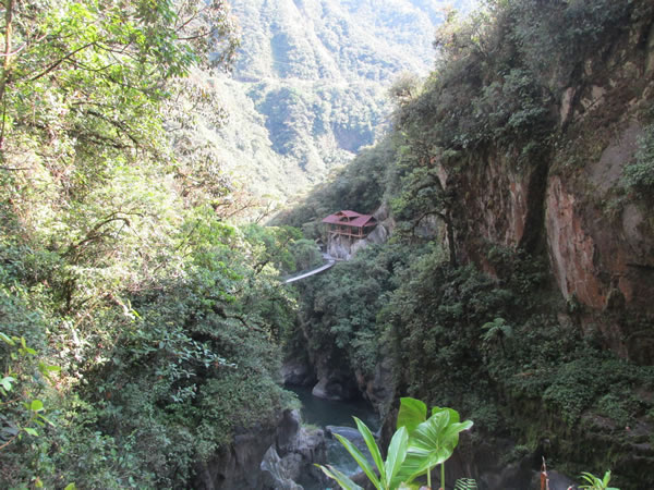Lodge with catwalk near Pailon Del Diablo waterfall.