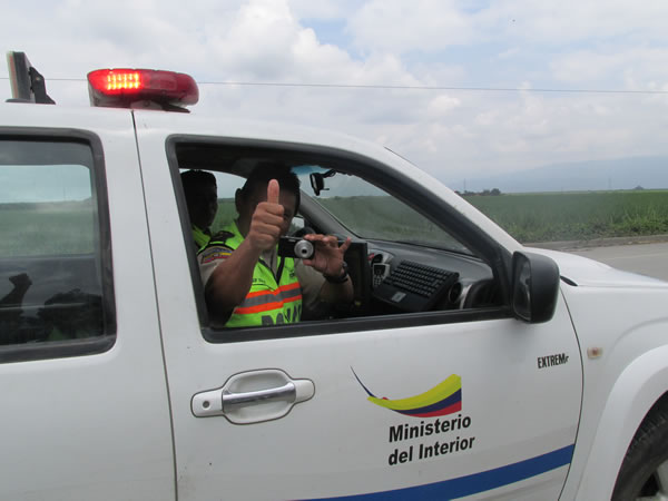 Police filming Ted between El Triufo and La Troncal, Ecuador.