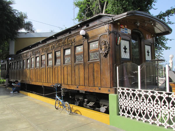 Ted’s bike in front of wooden train in Barranco district of Lima, Peru.  Ted thinks it was used as a restaurant.