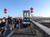 People crossing the Brooklyn Bridge in New York City.