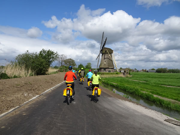 Netherlands – Nancy and Nancy in front of Ted about to pass another windmill
